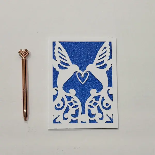Blue glitter paper-cut lovebirds card