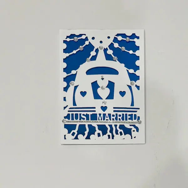 Blue paper-cut just married car card
